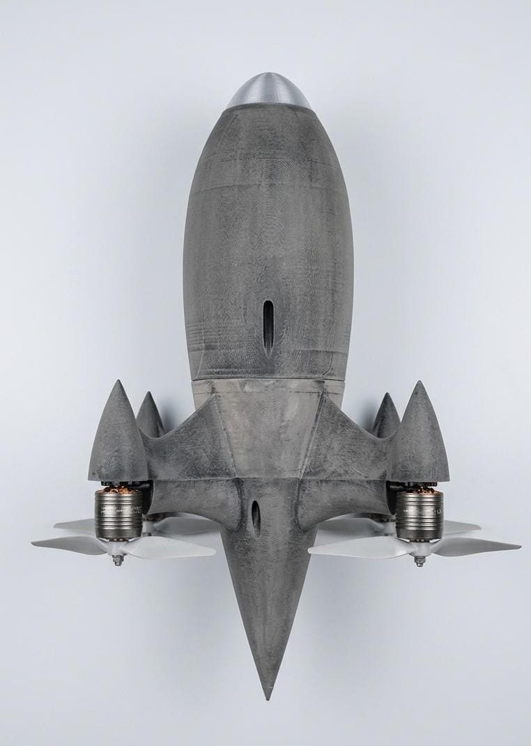 Scale model of the Ahuti airframe, photographed from directly above, showing the four motors at the corners of the arms